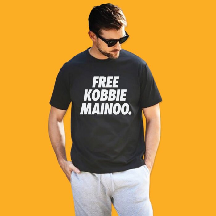 Black unisex t-shirt featuring bold white text 'FREE KOBBIE MAINOO' on the chest.