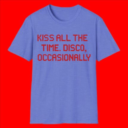 A man wearing a black unisex t-shirt with the red pixelated text "KISS ALL THE TIME. DISCO, OCCASIONALLY" standing against a yellow background.