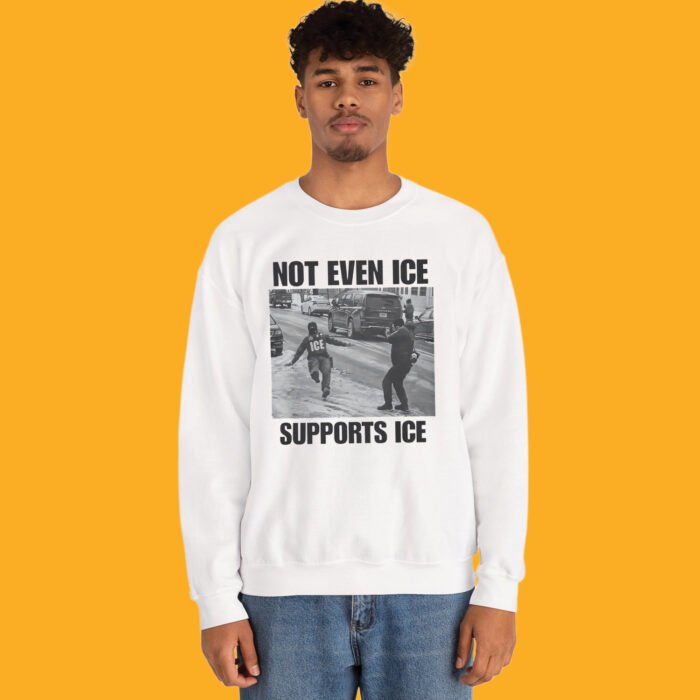 White t-shirt featuring a black and white viral meme photo of an ICE agent slipping on an icy road with the caption NOT EVEN ICE SUPPORTS ICE.