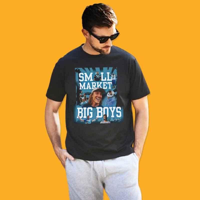 Black unisex t-shirt featuring "Small Market Big Boys" slogan in teal and white text with a collage of Trevor Lawrence and Jacksonville football players.