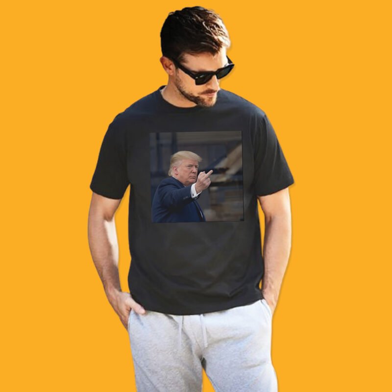 Donald Trump flipping the middle finger to a Ford factory worker in Dearborn Michigan on a black t-shirt.