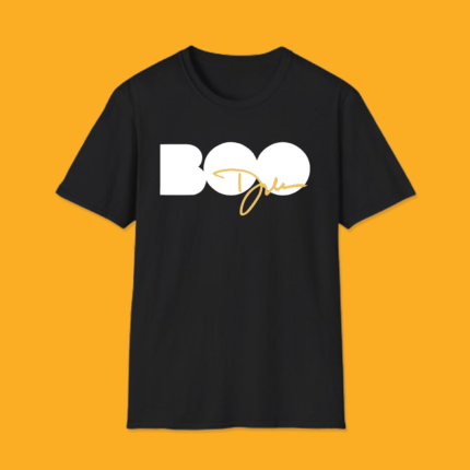 Black t-shirt displaying the word "BOO" in large white block letters with a stylish gold cursive signature written across the bottom half.