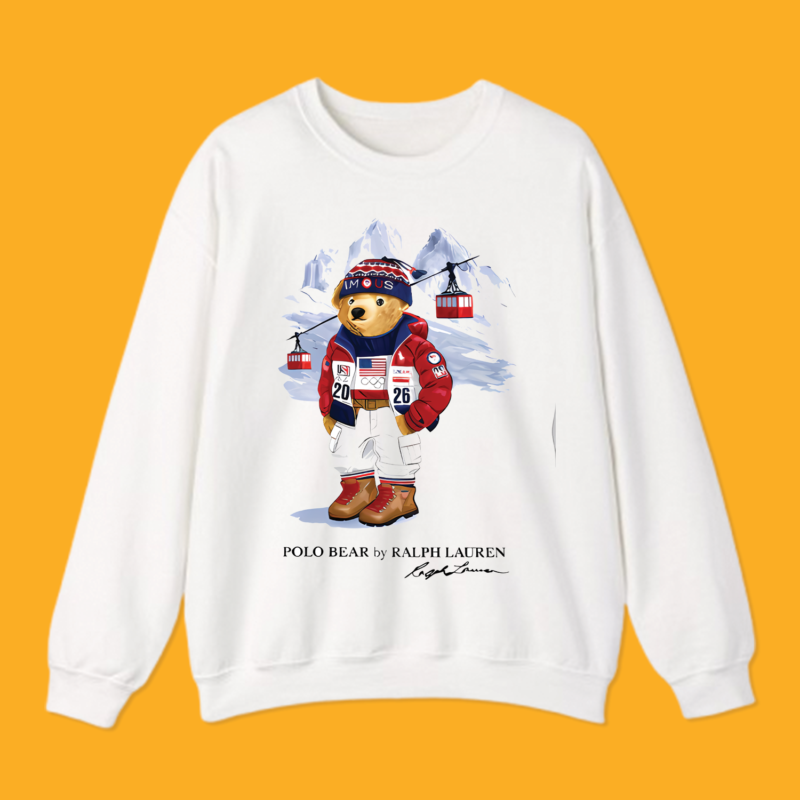 Man wearing white 2026 Winter Olympics Polo Bear graphic t-shirt against yellow background.