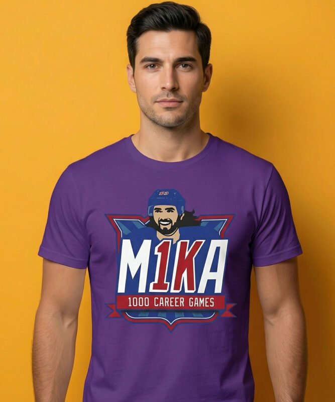"A sports-themed apparel design celebrating a 1000-game career milestone. The logo uses a red, white, and blue color palette with bold typography and a portrait of a bearded hockey player in a helmet."